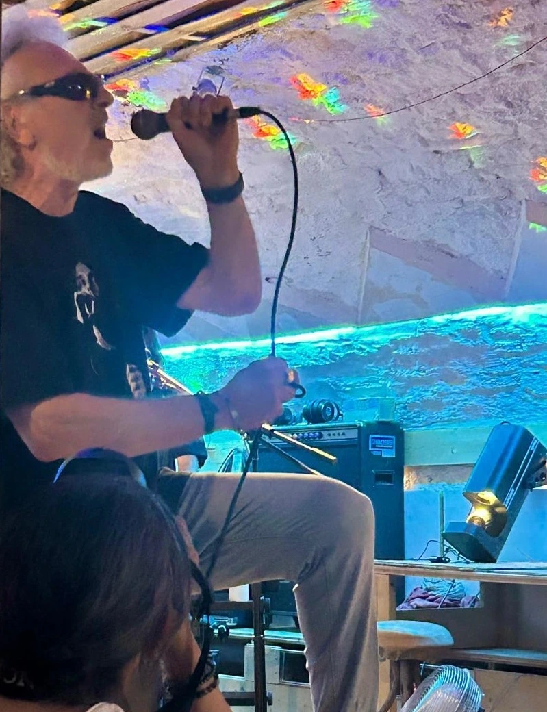 Lead vocalist Thierry Lenoble singing during a Quetzal live performance